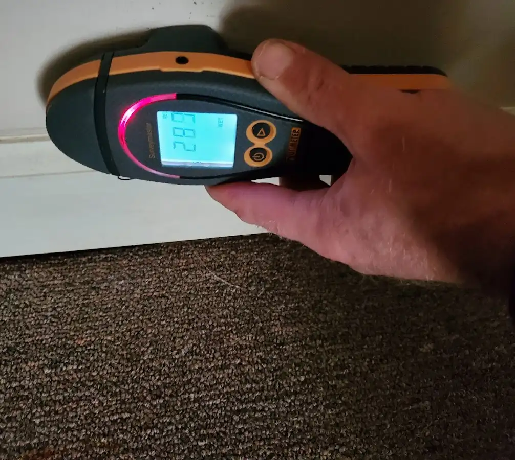 Moisture detection at baseboard during Storm Damage Restoration in Gridley